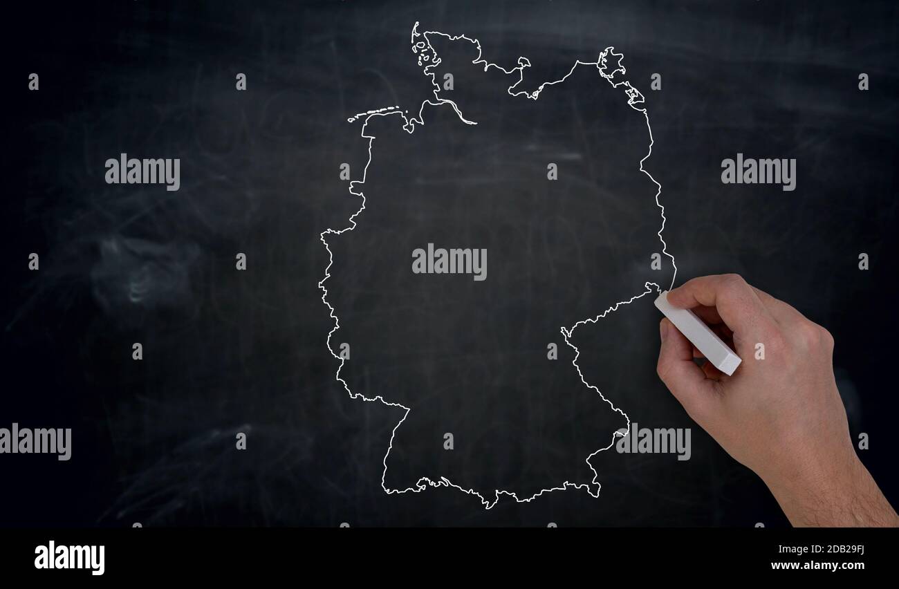 Germany map is written by hand on blackboard. Stock Photo