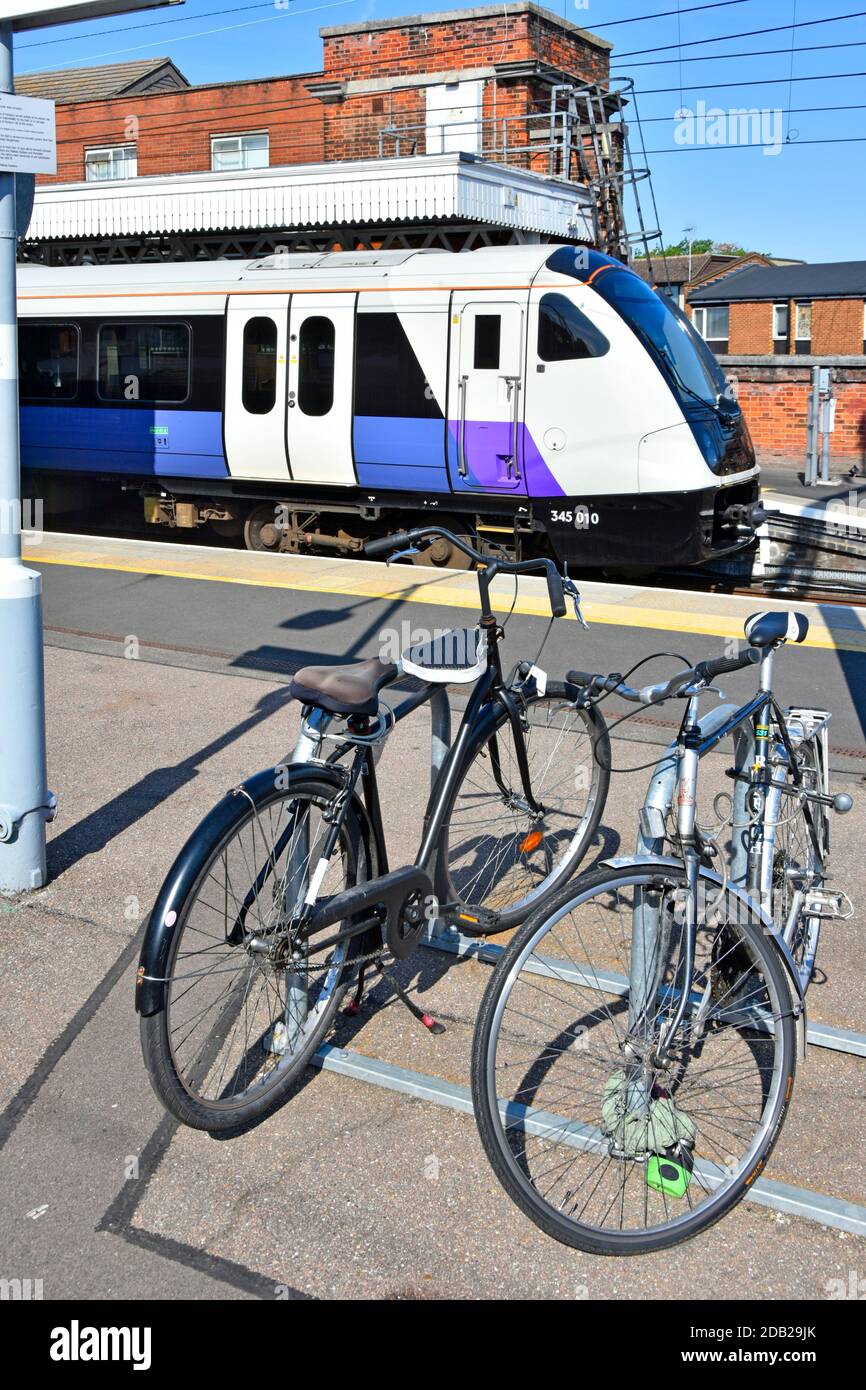 Bicycle rack platform parking for bike of  commuters cycling to local railway station London bound Crossrail train at Shenfield Brentwood Essex UK Stock Photo