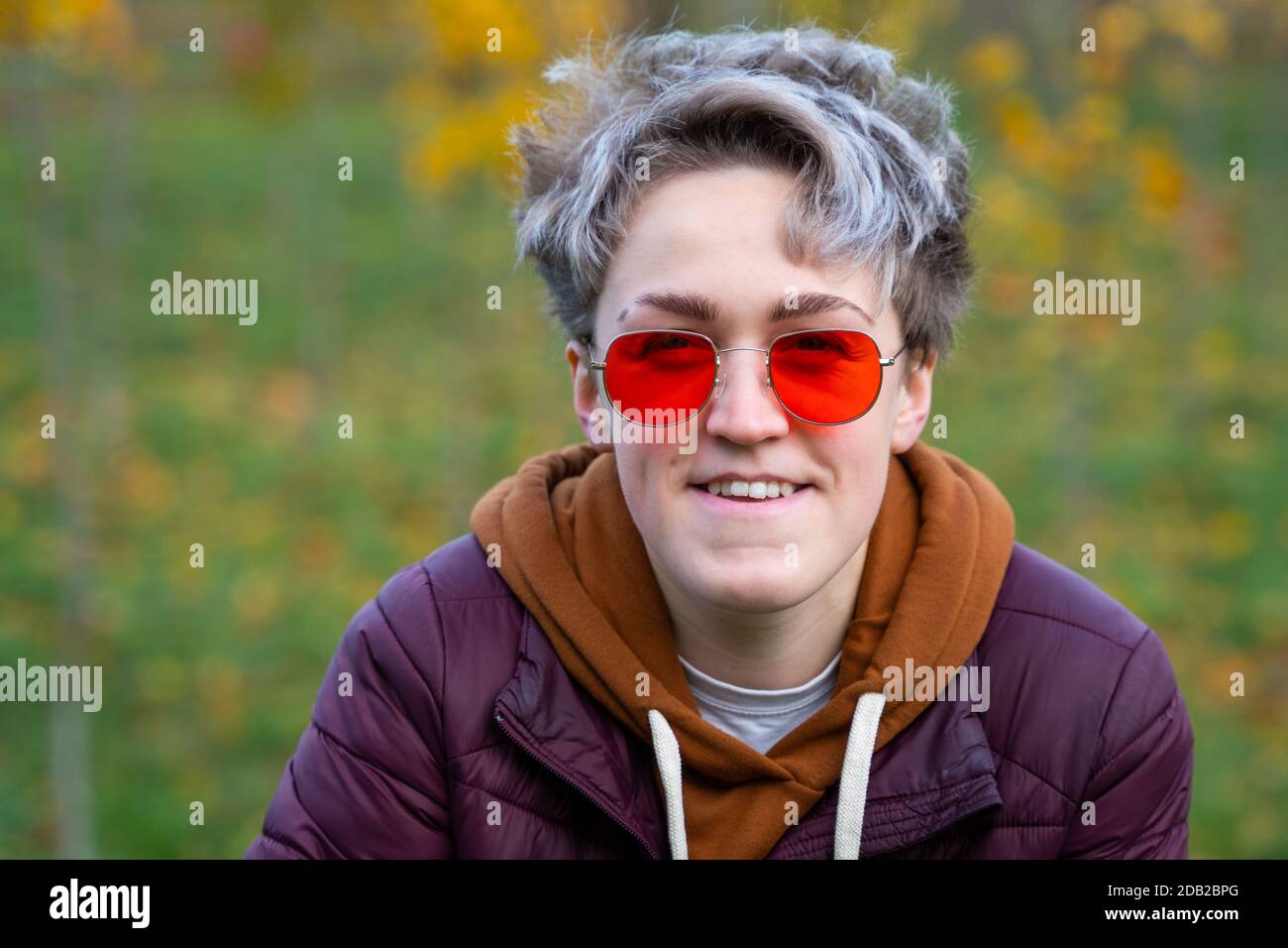 New femininity gender neutral style. Young woman with stylish short