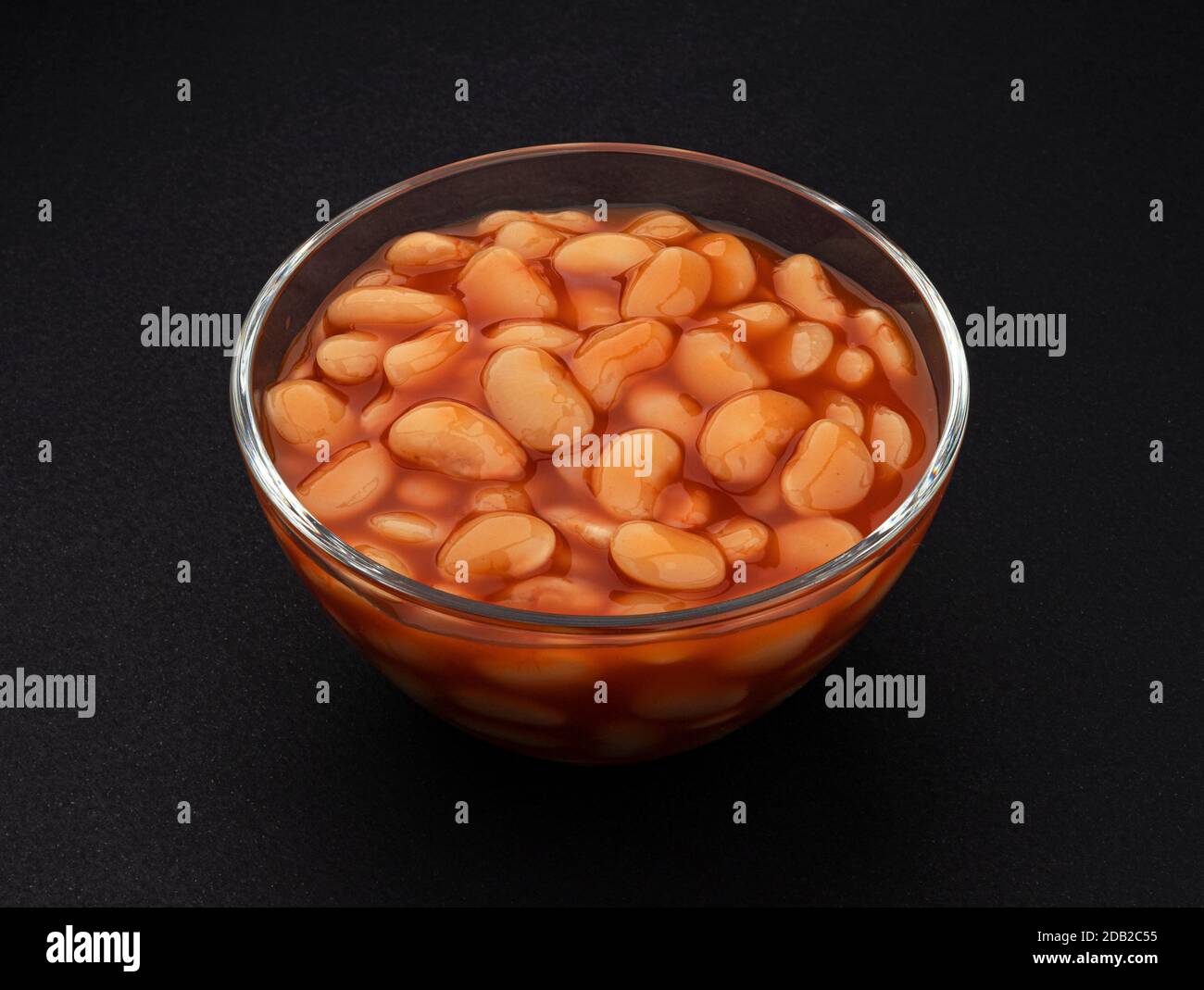 Baked beans in tomato sauce on black background Stock Photo Alamy