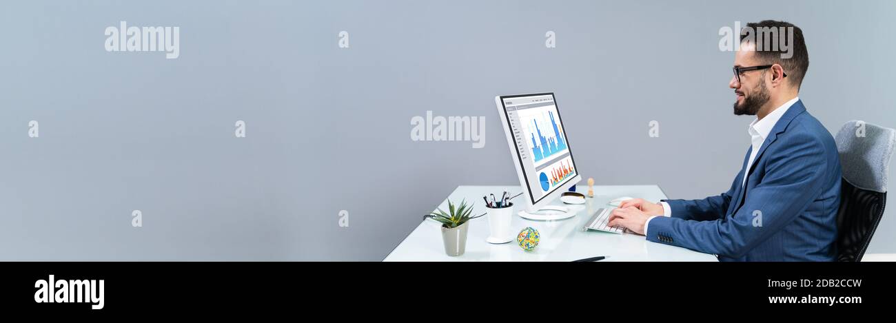 Business Analyst Man Working On Computer In The Office Stock Photo