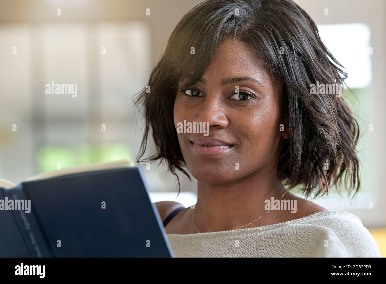 Old african woman reading hi-res stock photography and images - Alamy