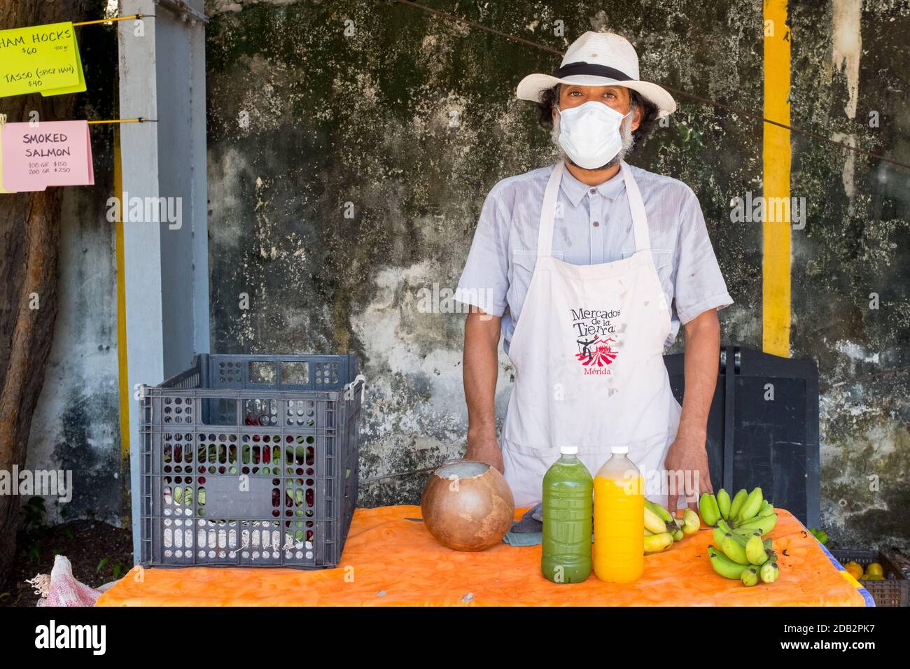 Man selling fruits and vegetables at the Slow food Farmers Market