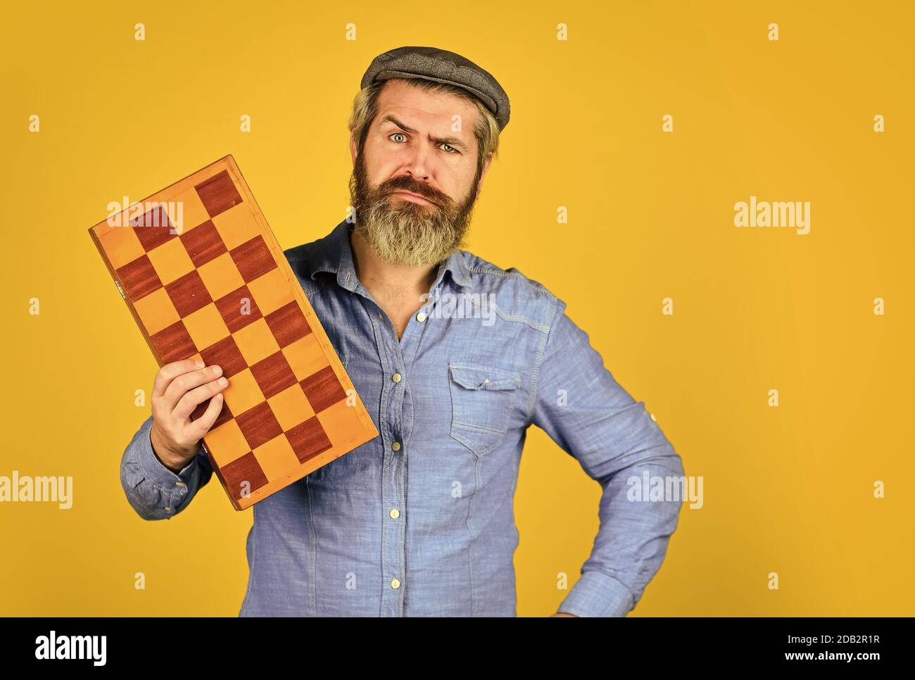 brainstorming concept. play chess tournament. Intelligence level measurement. level up your iq. bearded man hold chess board. intelligence quotient concept. human brain working. copy space. Stock Photo