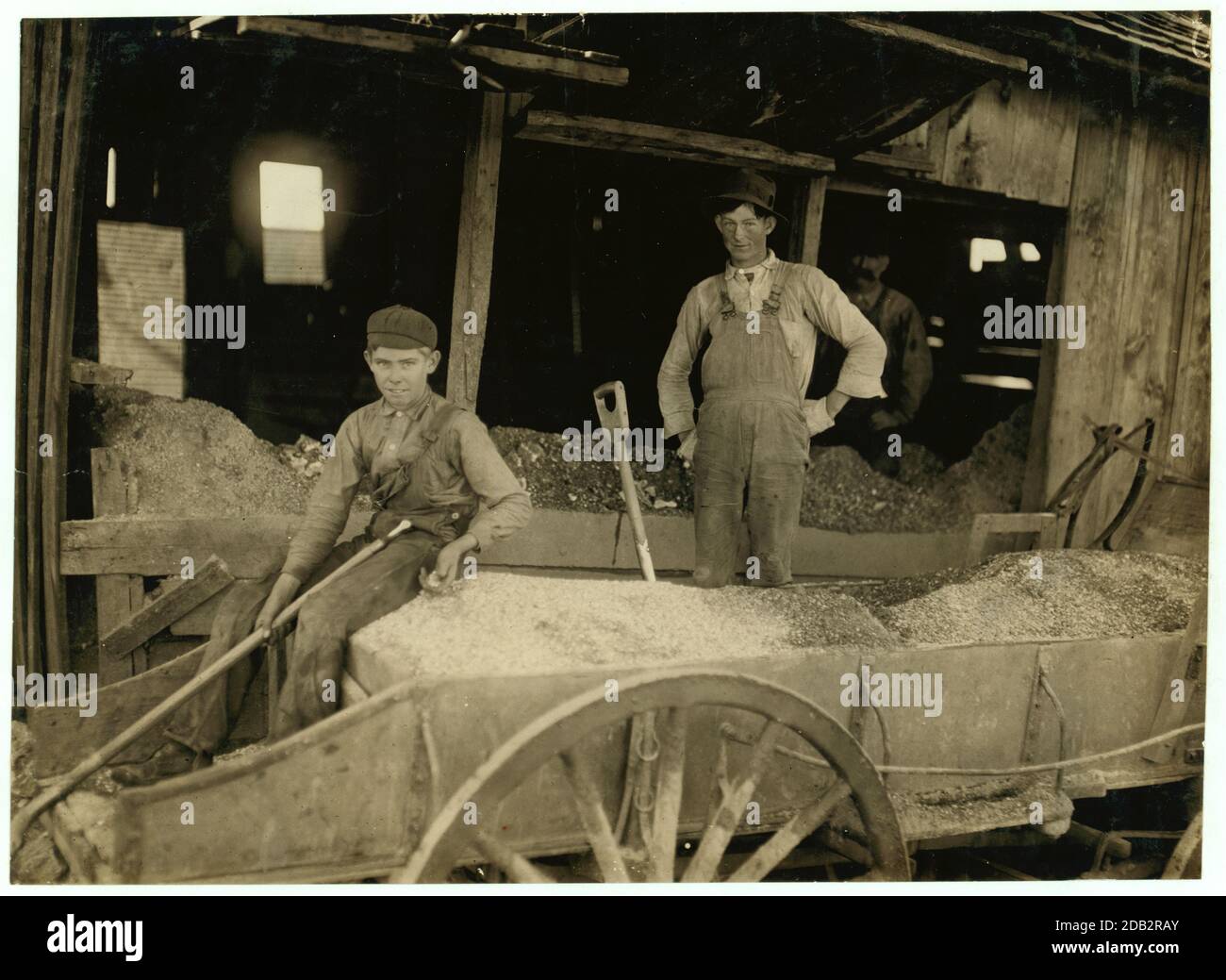 A Boy (may be over 14) at Heavy Work. Shoveling Ore at Daisy Bell Mine