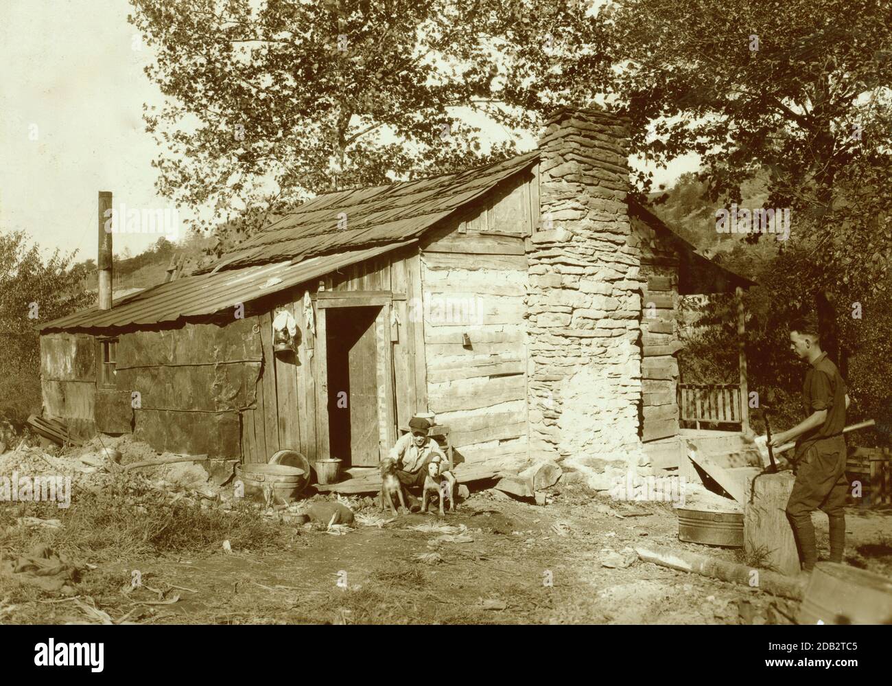 little log cabin, relic of the old days, now occupied by a small