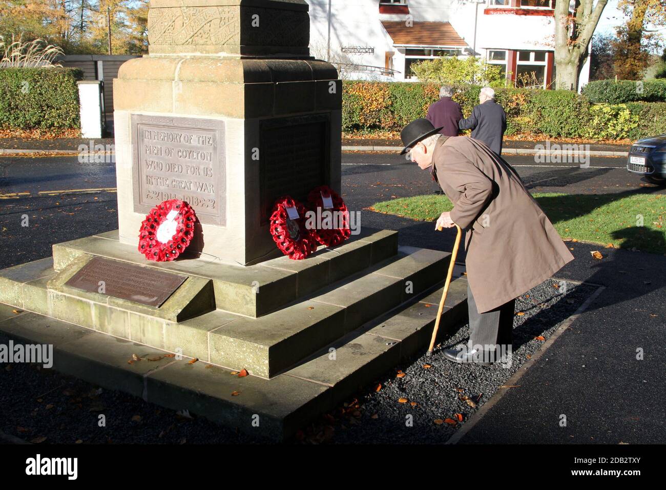 Coylton, South Ayrshire, Scotland, Remembrance Sunday at the War Memorial. An elderly gentleman