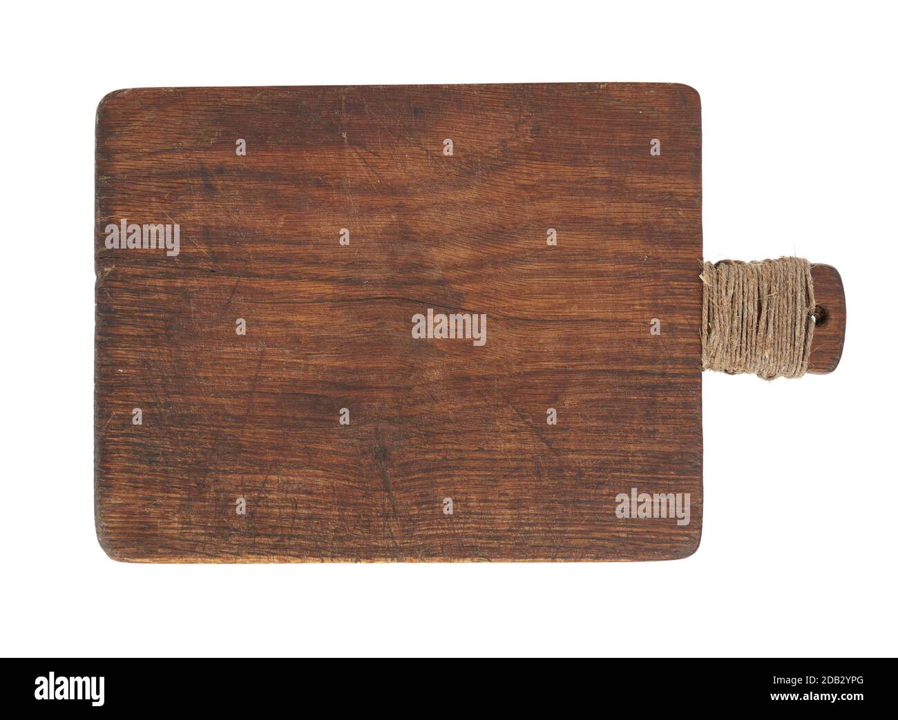 very old brown wooden kitchen cutting board with a rope wrapped in a ...