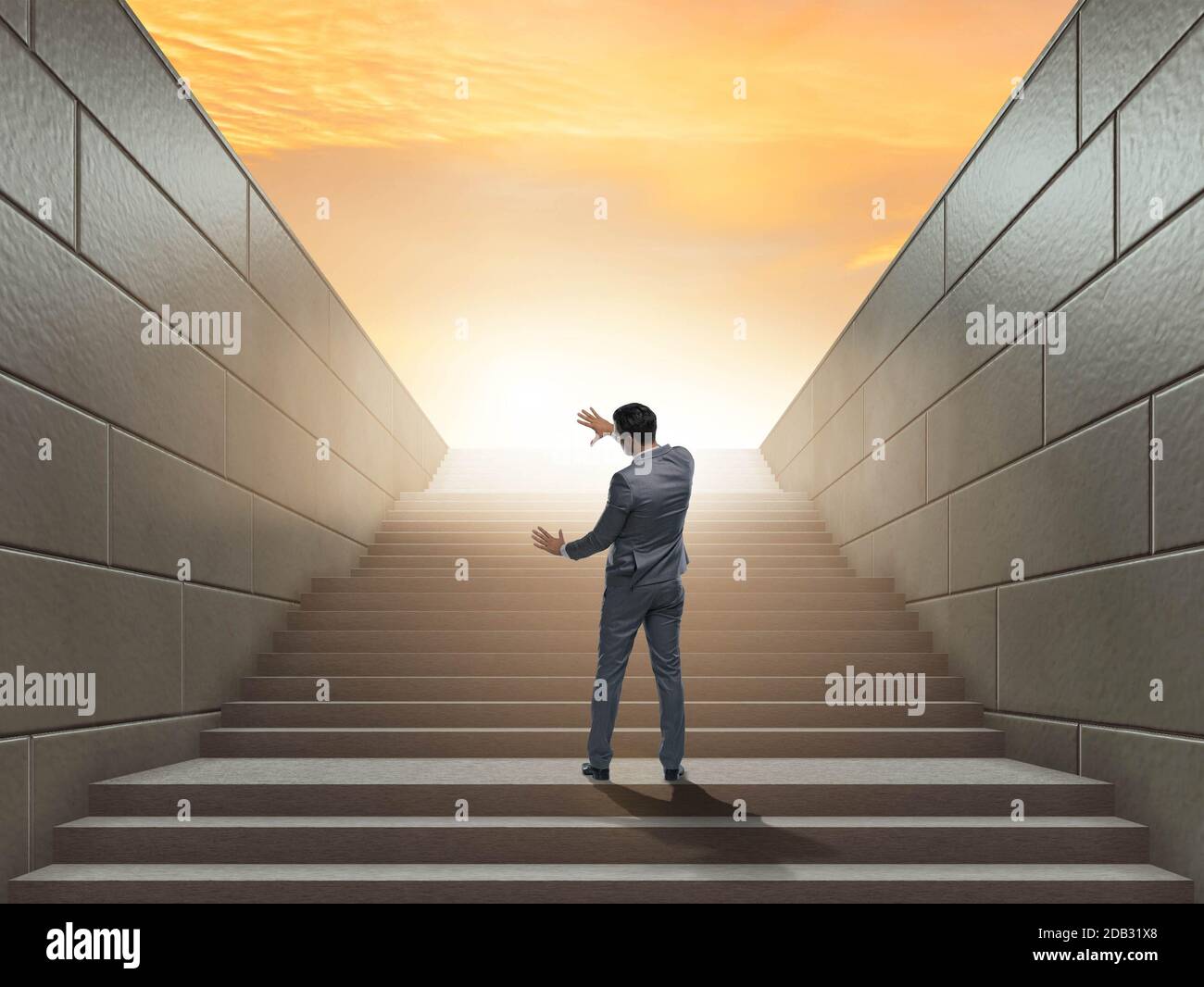Businessman climbing up challenging career ladder in business concept ...