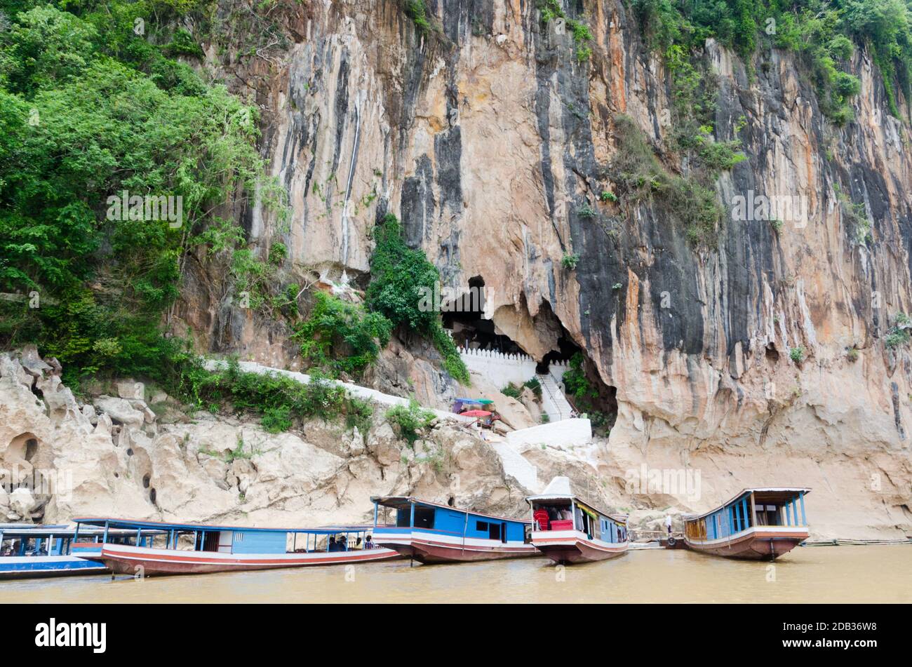 The Pak Ou Caves, known as the Cave of a Thousand Buddhas, are located on a cliff along the Mekong river, some 20 km north of Luang Prabang. Stock Photo