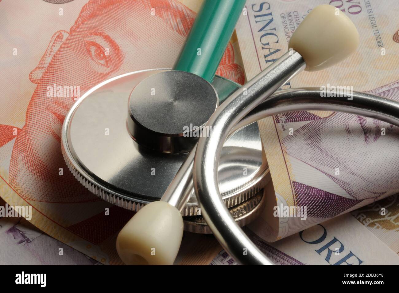 Various Singapore banknotes with stethoscope Stock Photo Alamy