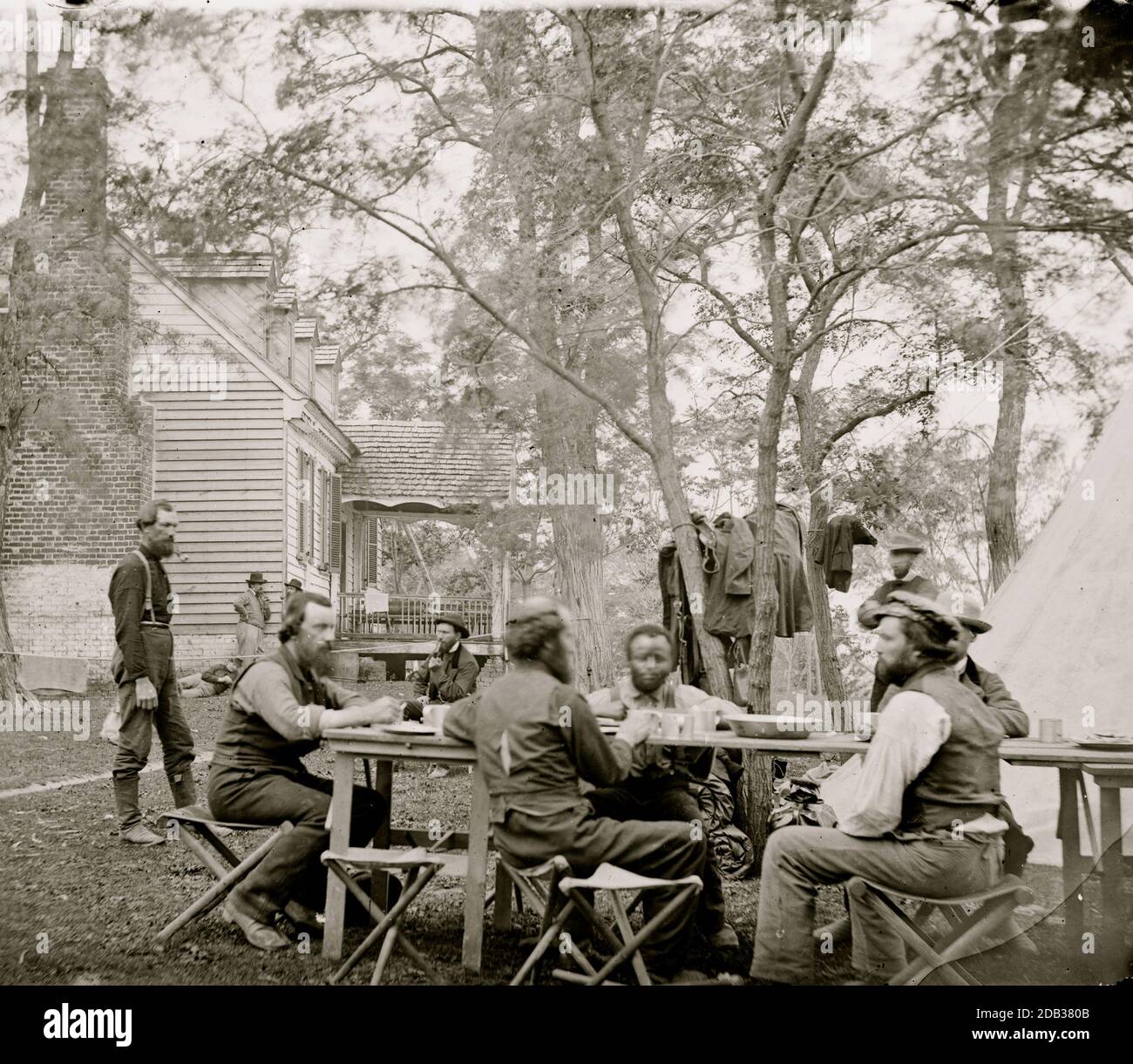 Cumberland Landing, Va. Secret Service men at Foller's House; Black seated as an equal at a table. Stock Photo