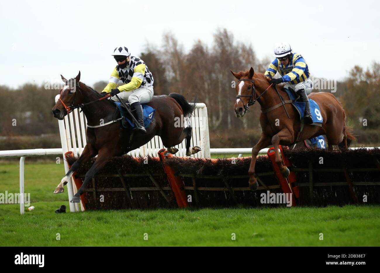 Megan ridden by Jonathan Burke (right) clears the last before going on to win the Graham The Plumbers' Merchant Fillies' Juvenile Hurdle at Leicester Racecourse. Stock Photo
