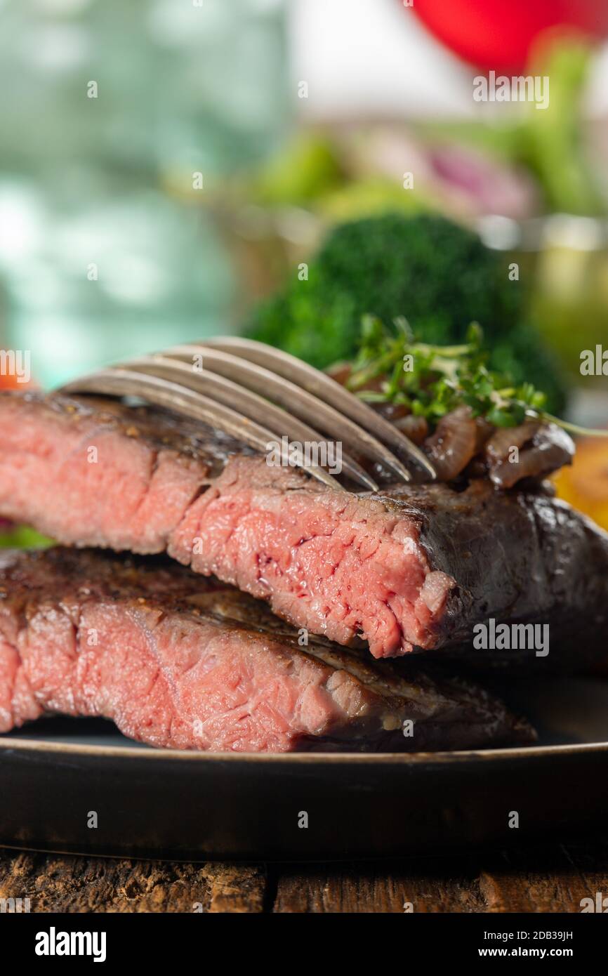 halves of a steak on a plate Stock Photo