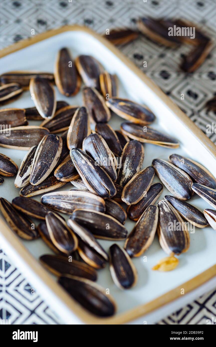 Sunflower Seeds on White Dish Stock Photo