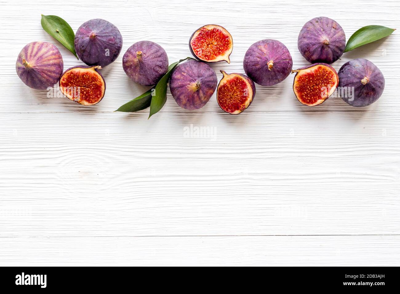 Flat lay of figs on a kitchen table, top view Stock Photo