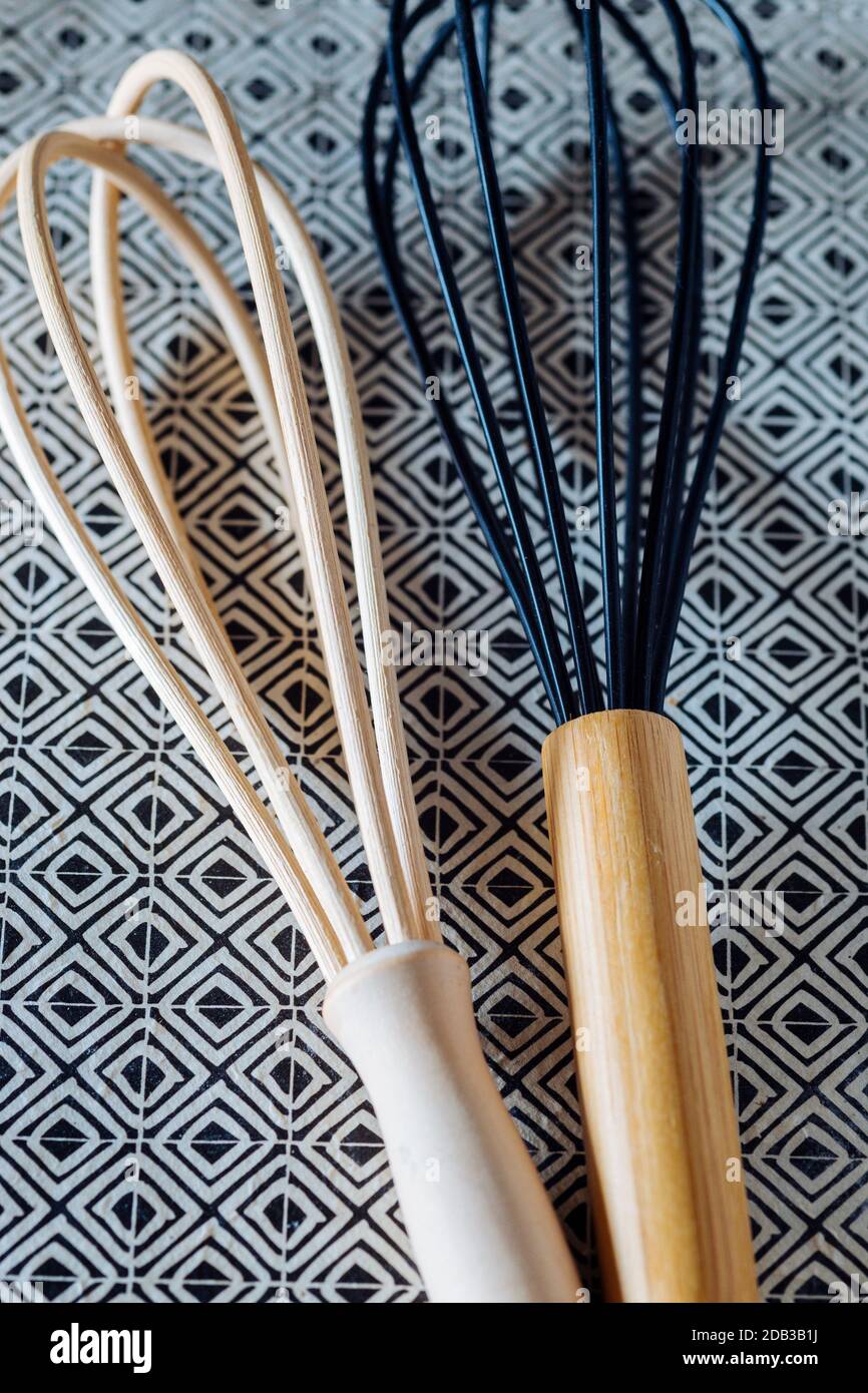 Wooden Whisk and Silicone Whisk on Patterned Background - Cooking Equipment - FOODPIX Stock Photo