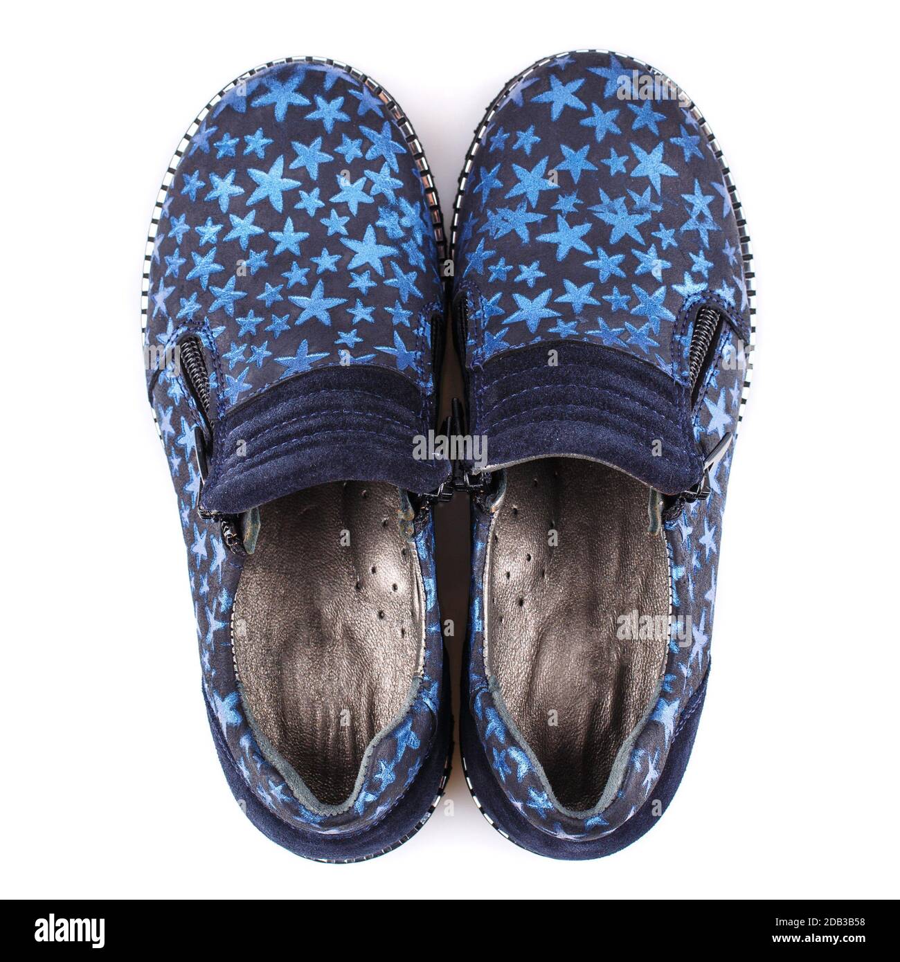 Baby black shoes for boys with blue stars on a white background. Photo