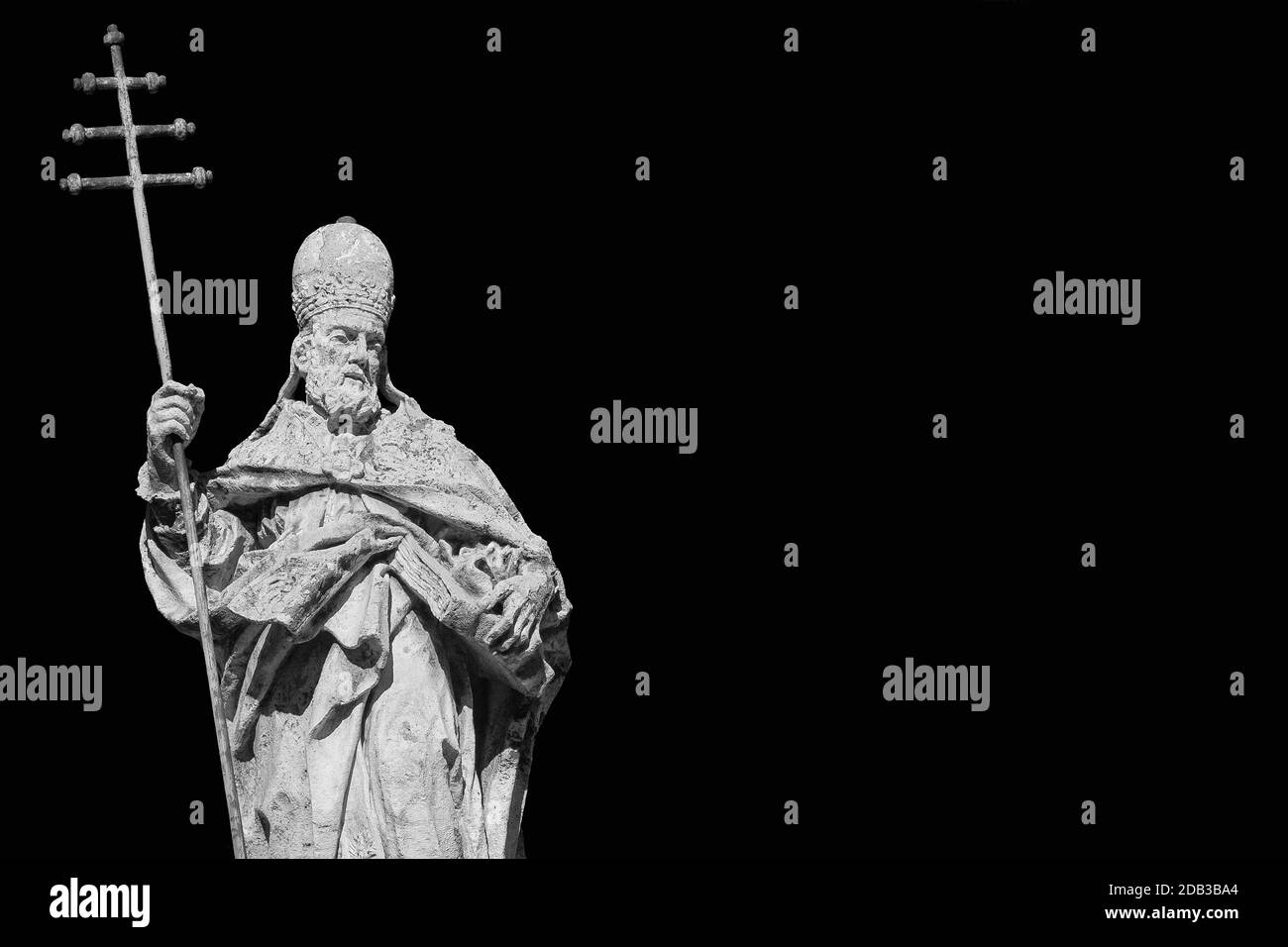 Pope Sylvester I statue with cross, at the top of St Sylvester Church in Rome, erected in the 18th century (Black and White with copy space) Stock Photo