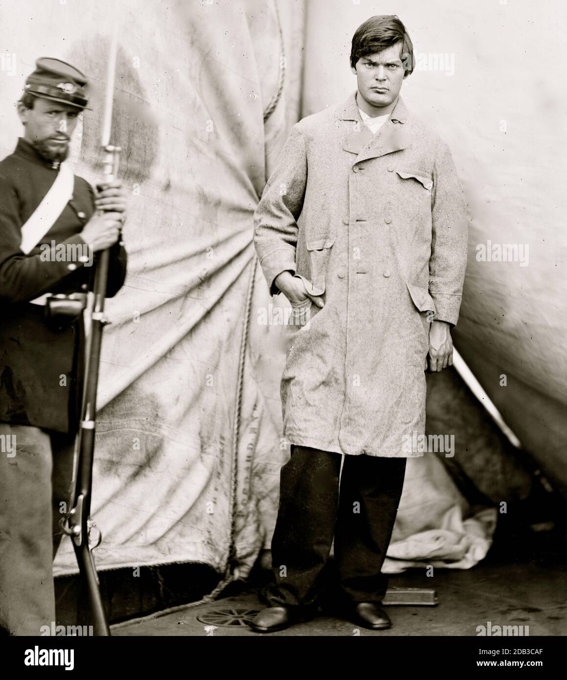Washington Navy Yard, District of Columbia. Lewis Payne, standing in overcoat and without hat. Federal guard standing on left. Stock Photo