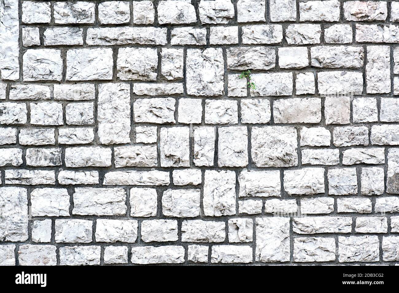 Background from a wall made of block shaped natural stones Stock Photo