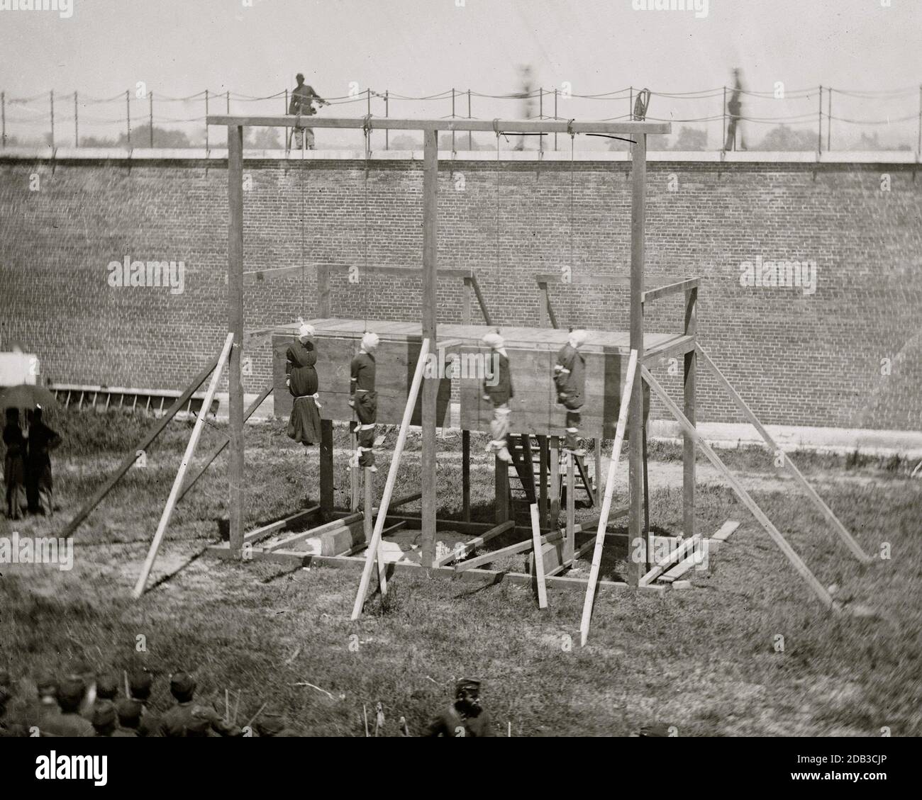 Washington, D.C. Hanging bodies of the conspirators; guards only in yard. Stock Photo