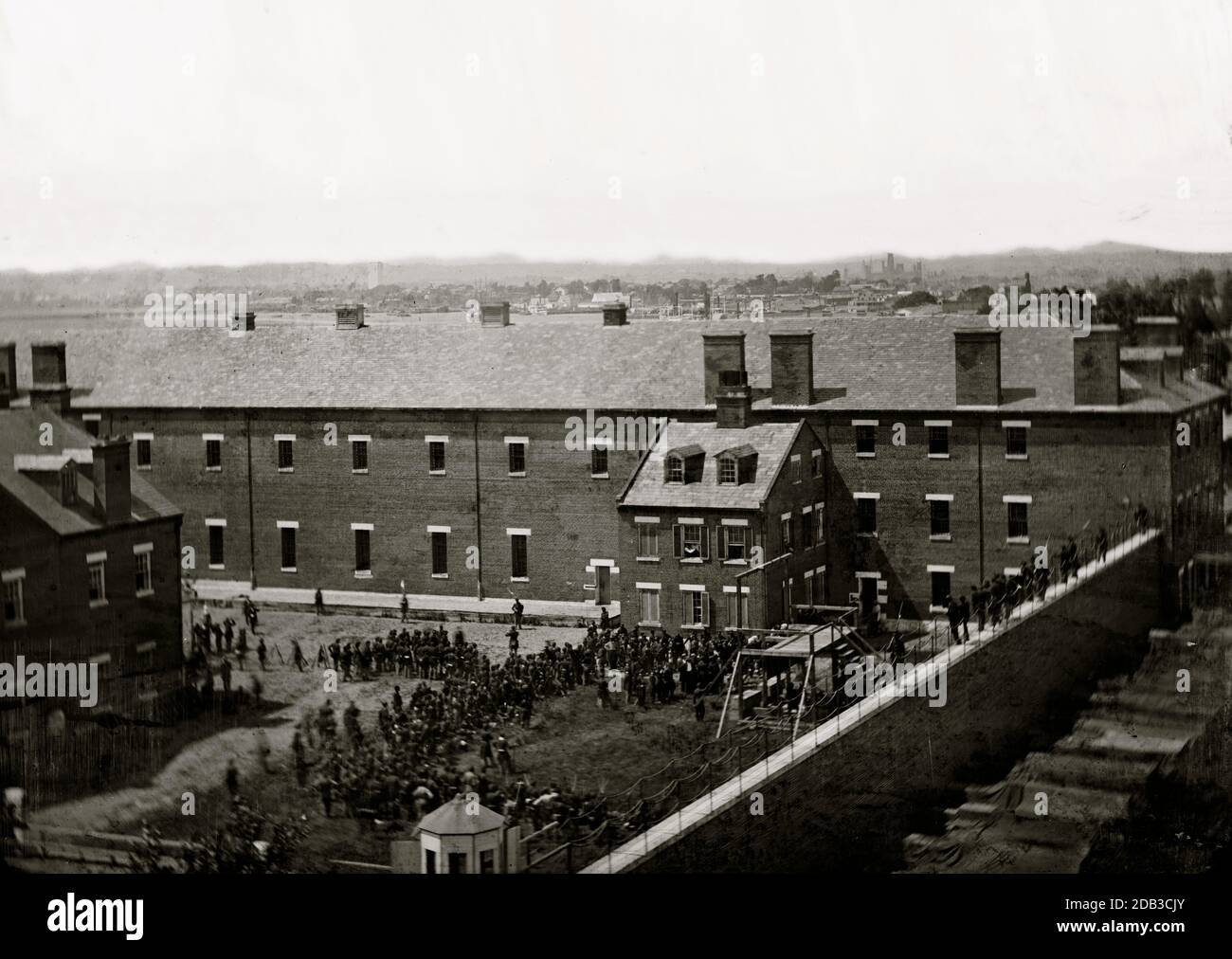 Washington, D.C. Execution of the conspirators: scaffold in use and crowd in the yard, seen from the roof of the Arsenal. Stock Photo