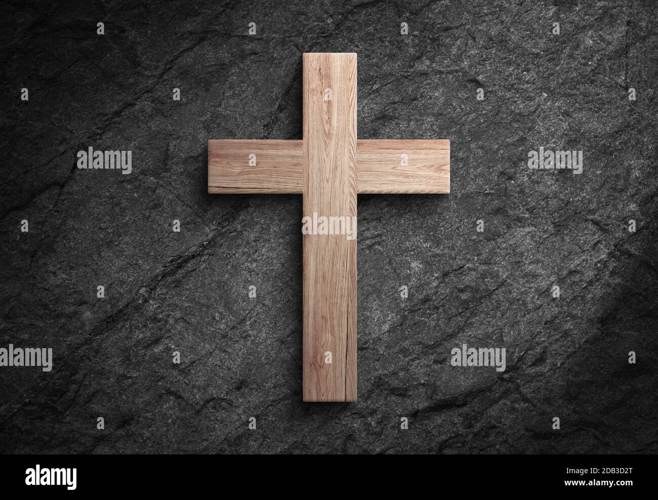 Christianity wooden cross of jesus christ sign and dark stone wall with spotlight and shadows Stock Photo