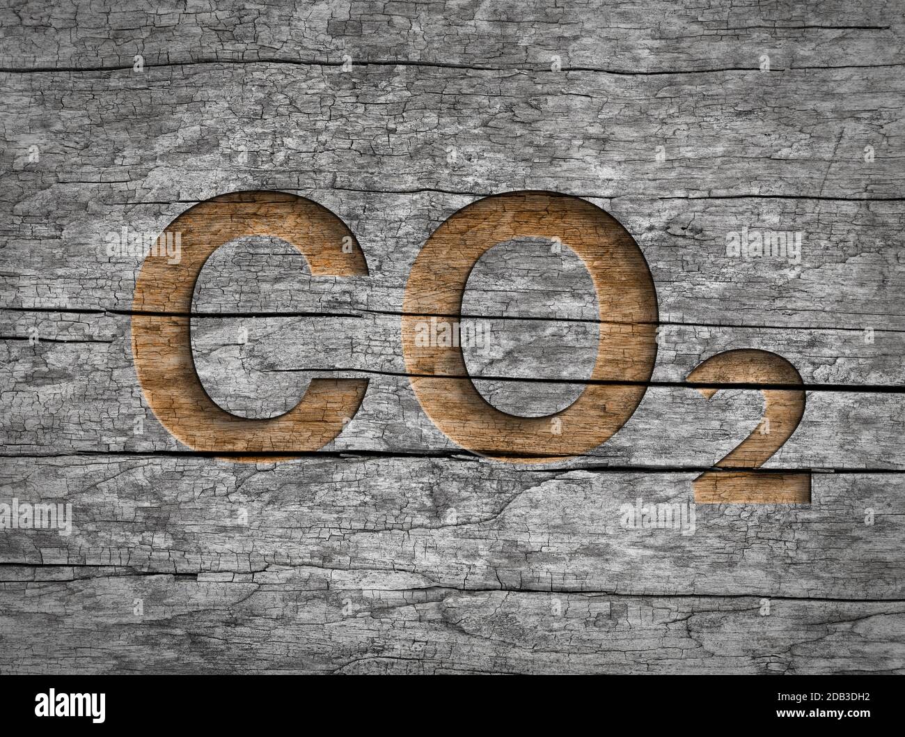 Co2 text written in wood for natural storage carbon dioxide emission or compensation Stock Photo