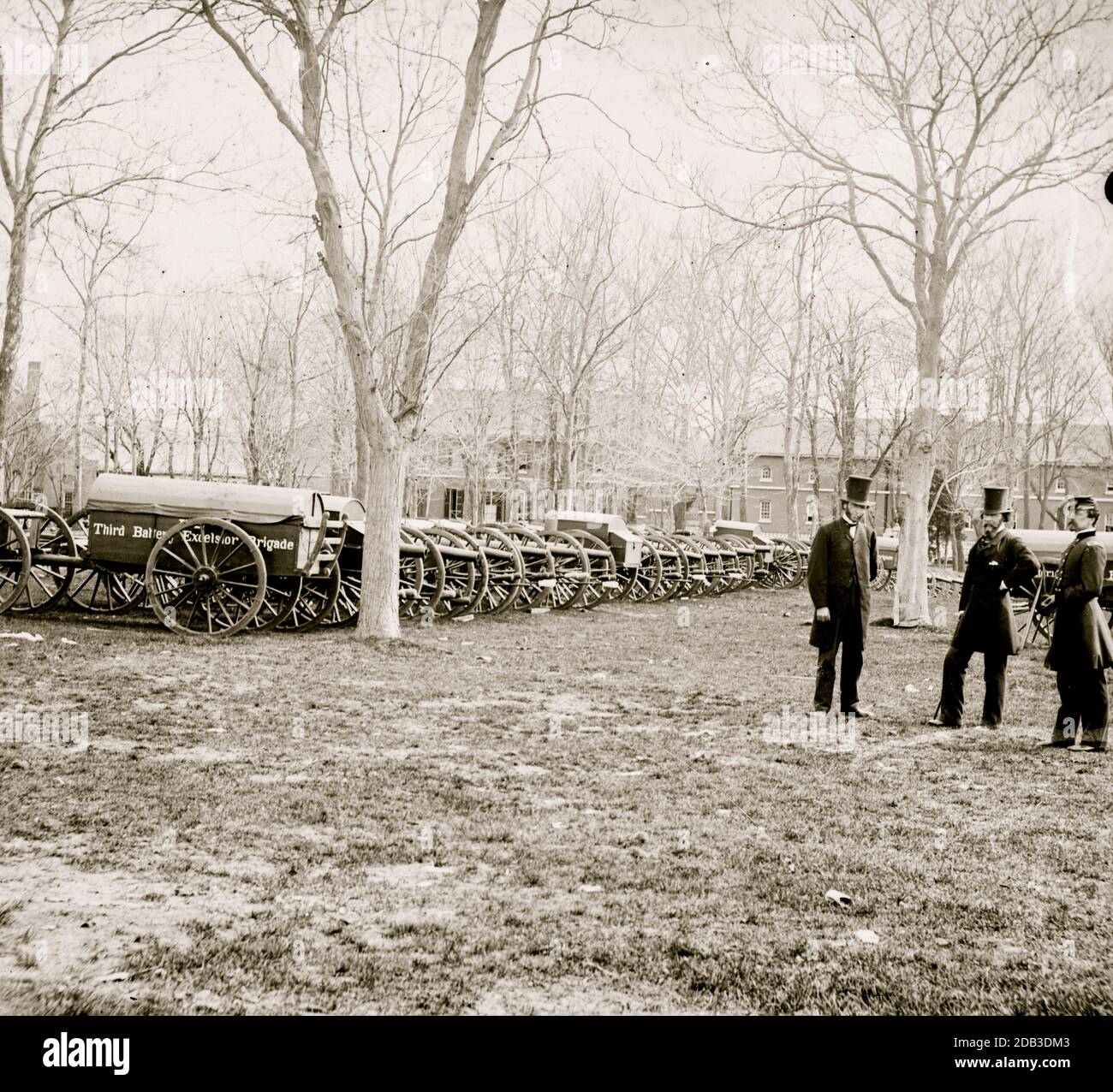 Washington, District of Columbia. Wiard gun at U.S. Arsenal. (L to R: Gen. Daniel Sickles, N.P. Willis, H.L. Stuart. Stock Photo