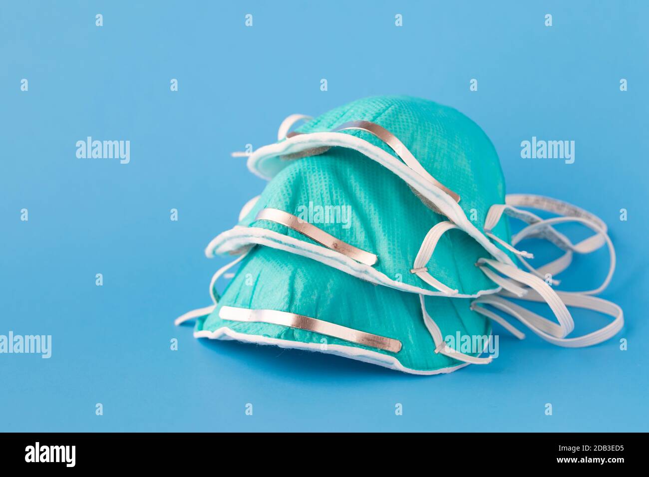medical mask to protect against flu, virus on blue background, coronavirus concept Stock Photo