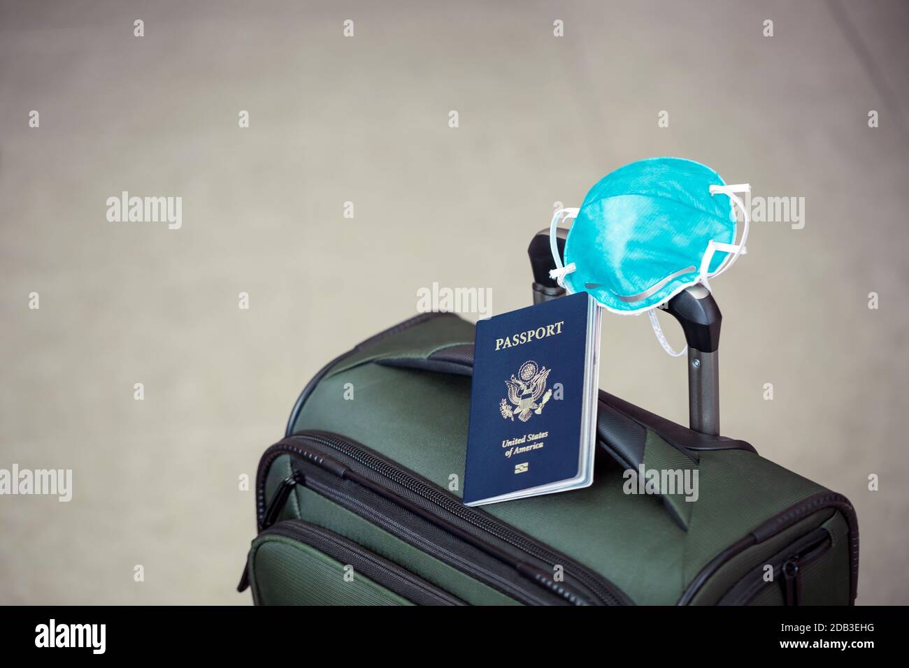 personal luggage with passport and flu virus mask to protect against coronavirus, global epidemic concept Stock Photo