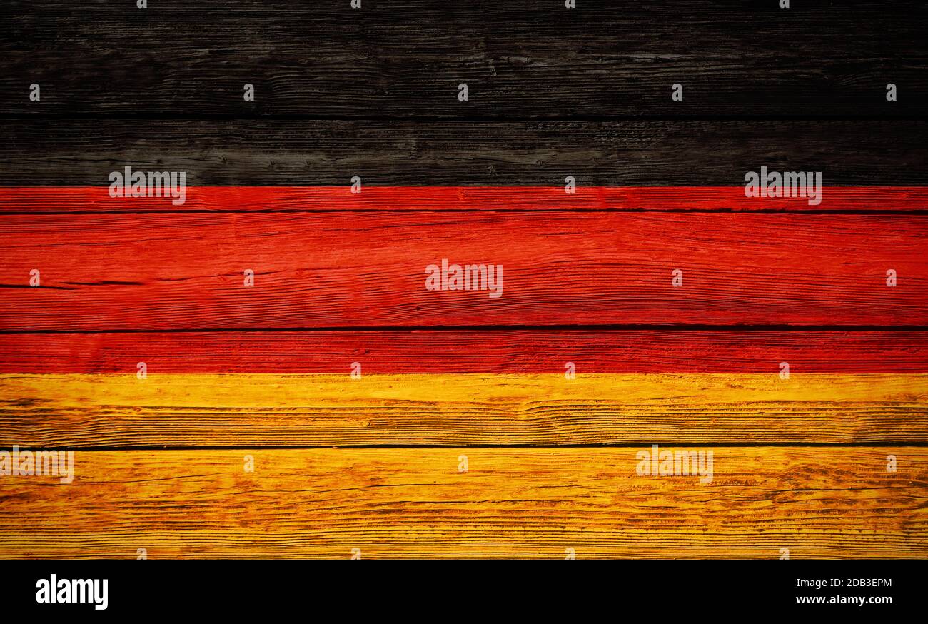 Germany national flag colors painted on old wooden plank background Stock Photo