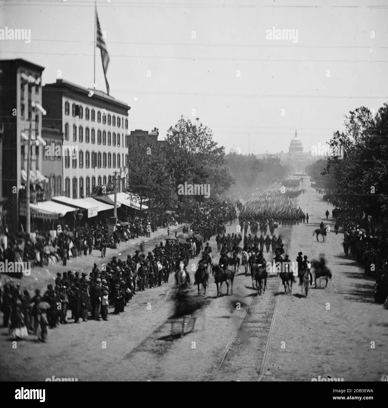 Washington, District of Columbia. The Grand Review of the Army. Gen. Jefferson C. Davis, staff and 19th Army Corps passing on Pennsylvania Avenue near the Treasury. Stock Photo