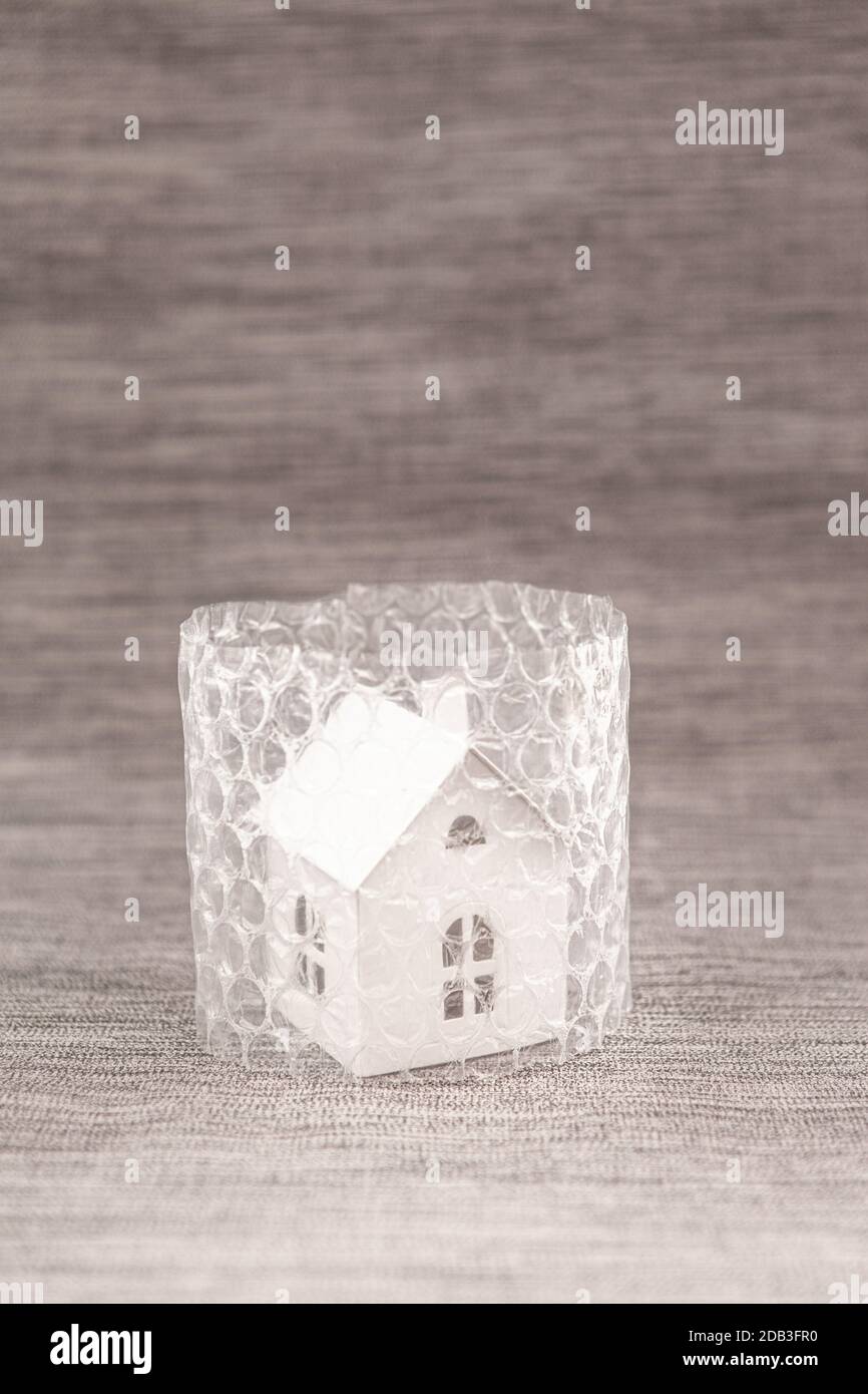 Little house in bubble wrap, isolation, protection concept Stock Photo