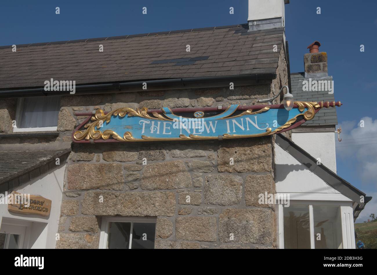 The New Inn Hotel and Pub Sign in the Harbour of New Grimsby on the Island of Tresco in the isles of Scilly, England, UK Stock Photo
