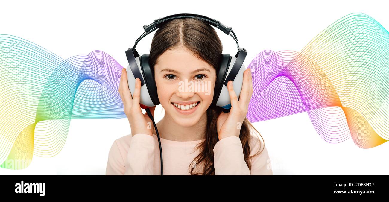 Smiling caucasian girl wearing special headphones during a procedure hearing test. Multicolored sound waves on background Stock Photo