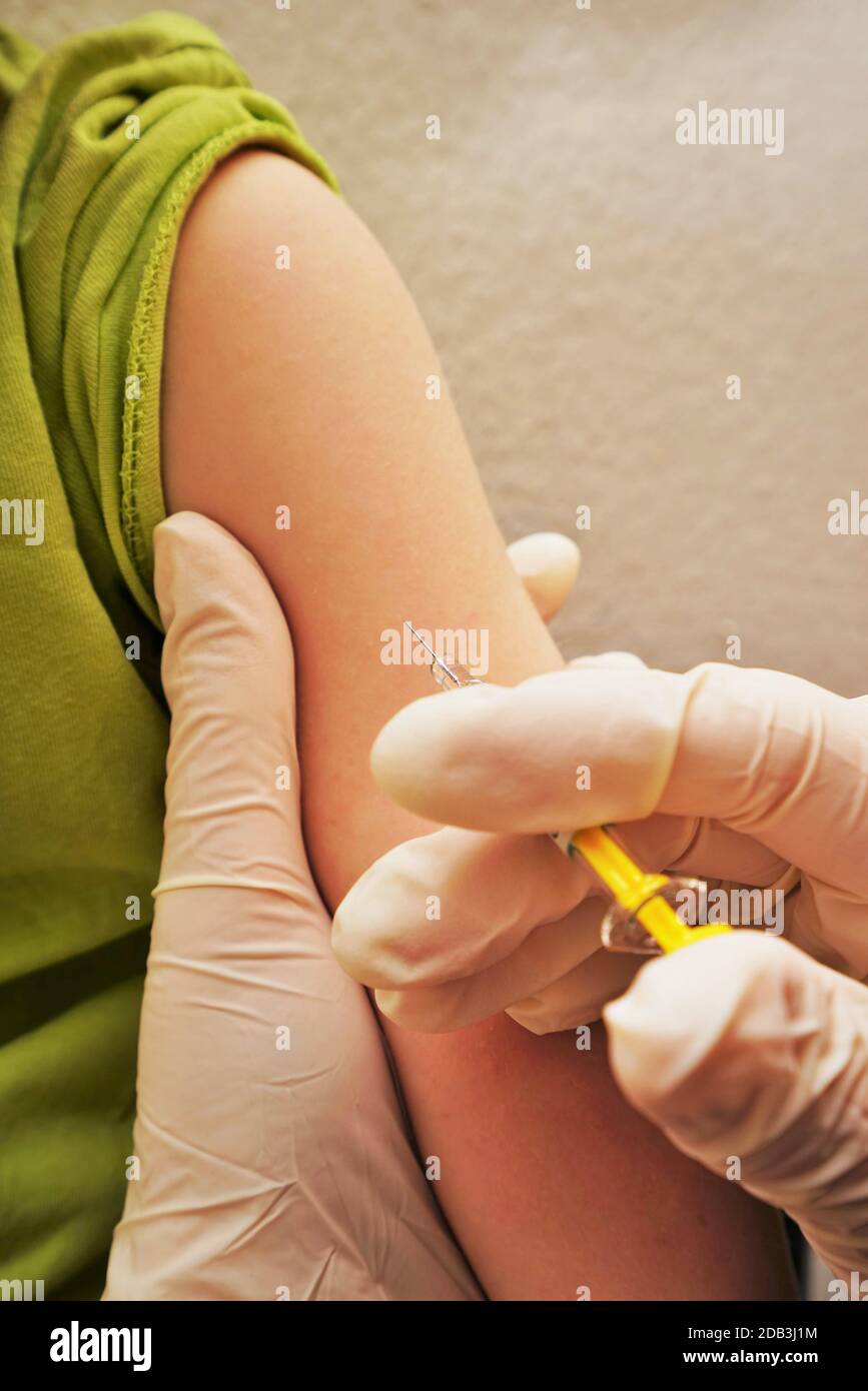Vaccination in the arm of a child Stock Photo