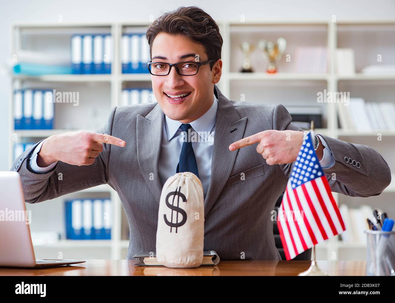 The businessman with american flag in office Stock Photo - Alamy