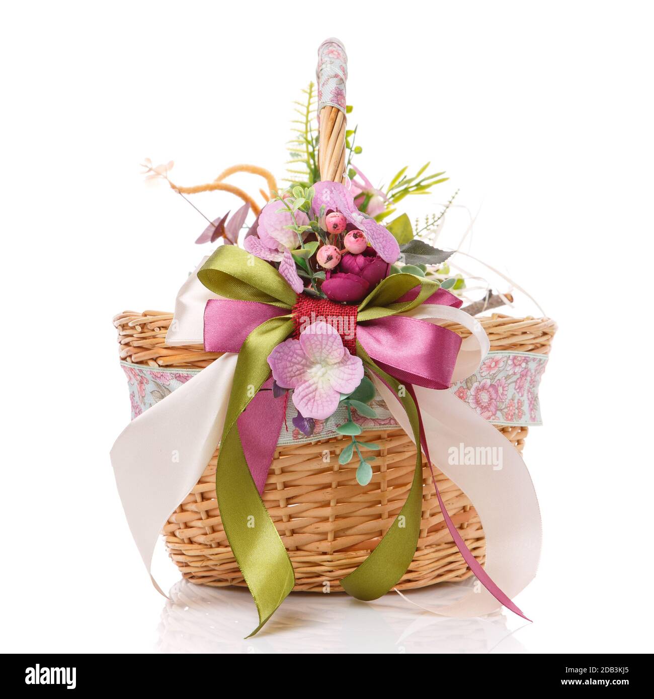 Wicker basket decorated with flowers on white background. Isolated ...