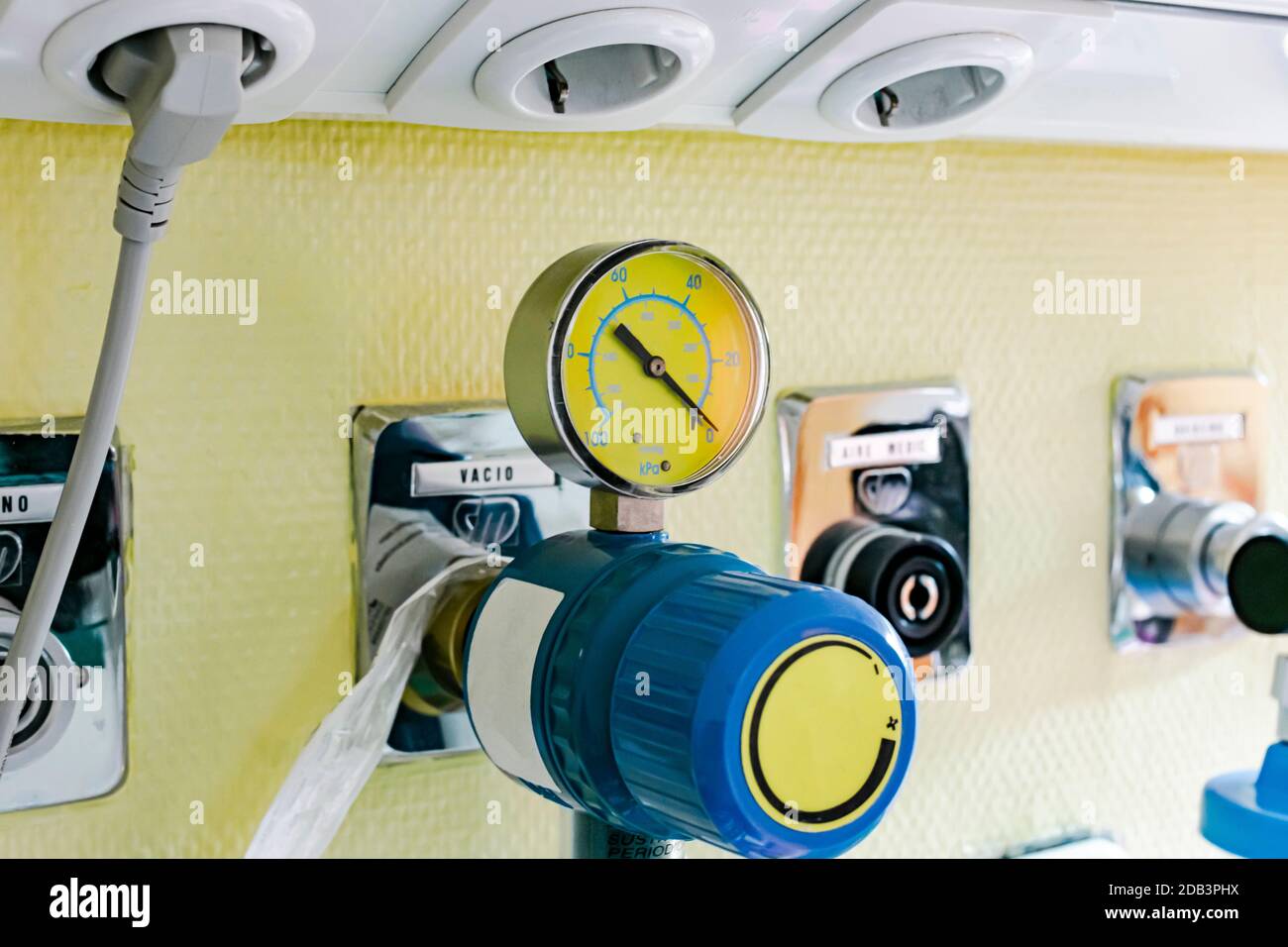 Pressure gauge with vacuum regulator and indicator clock to connect a suction pump in a hospital room Stock Photo
