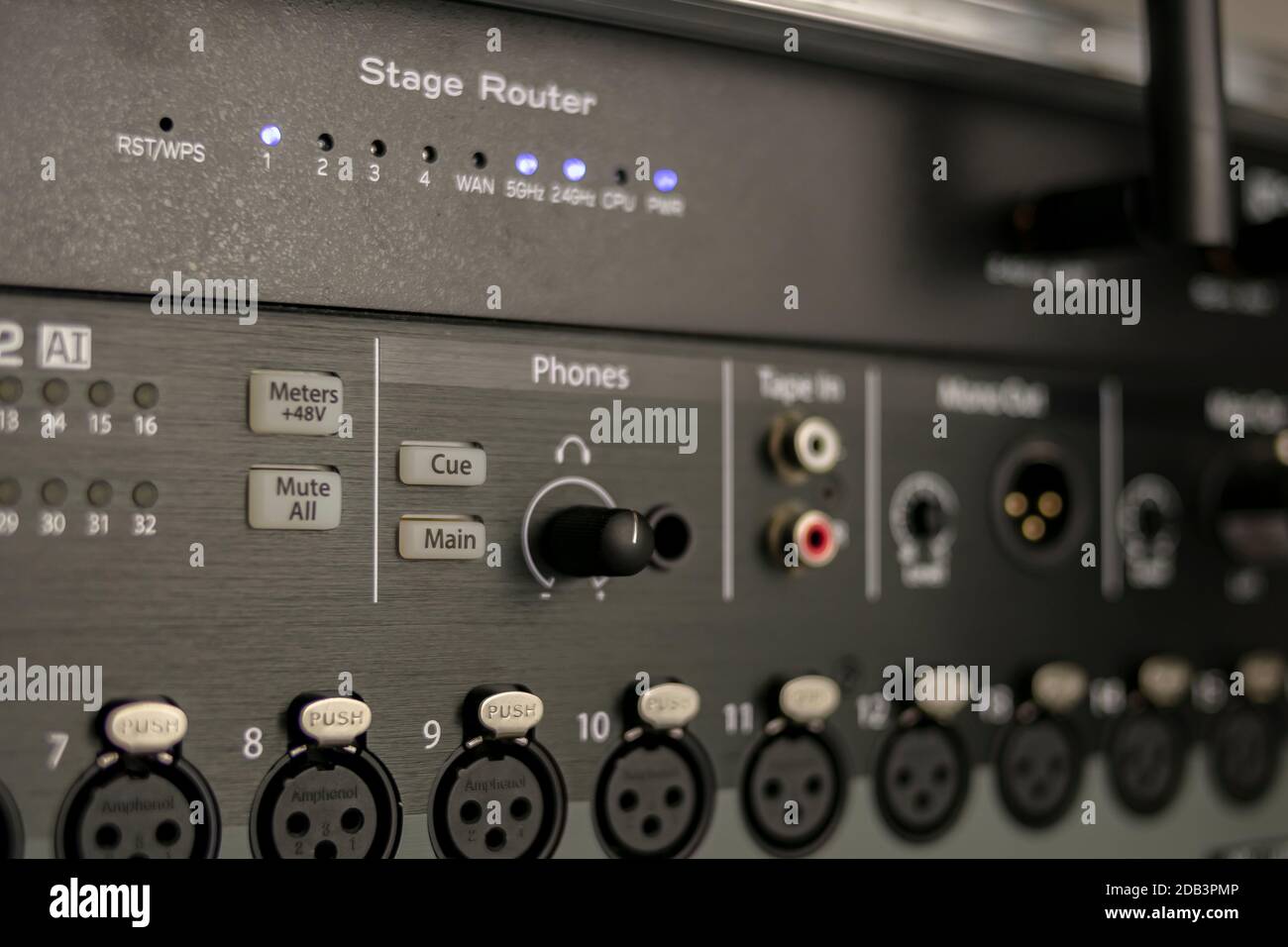 Set of audio inputs on a stage mixer with headphone output, phantom power buttons and stage