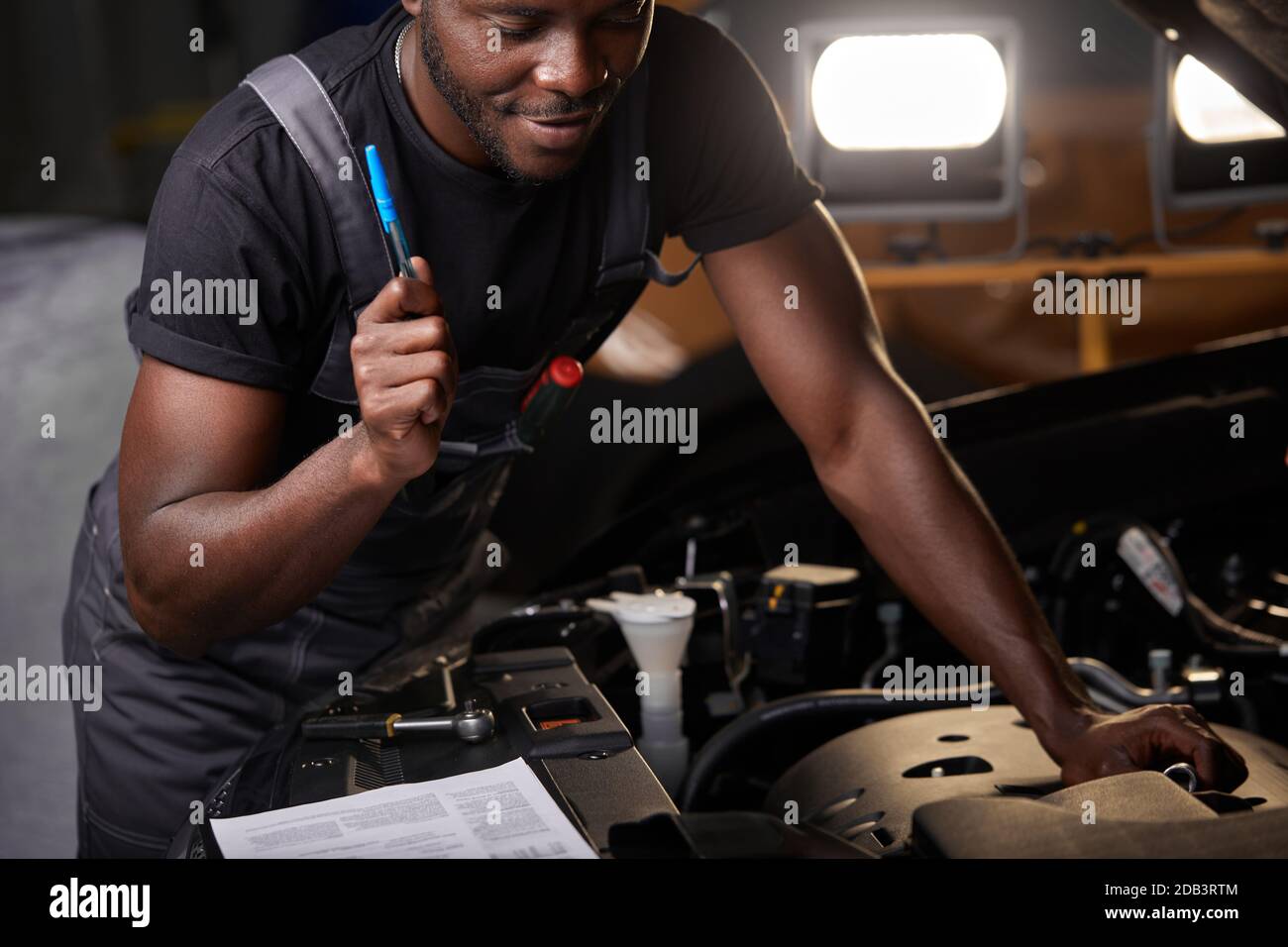 repairing in action. hardworking guy employee in uniform works in the