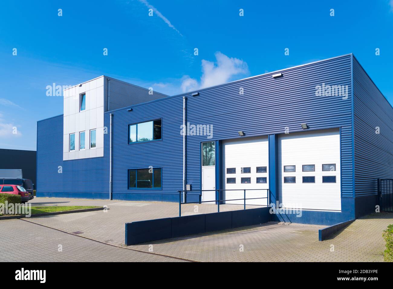 exterior of a modern warehouse with a small office unit Stock Photo Alamy
