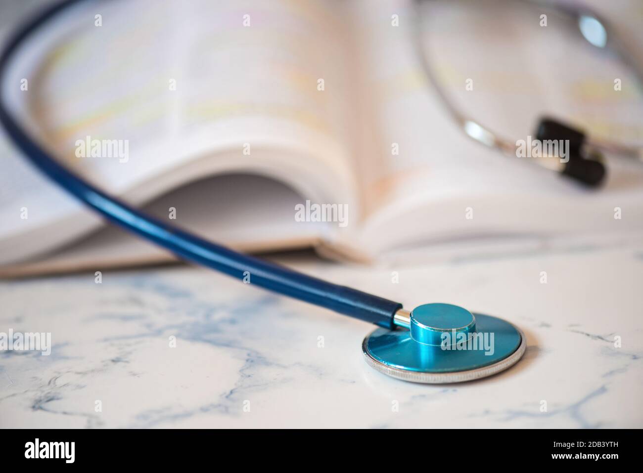 Stethoscope on the pages of a text book Stock Photo - Alamy