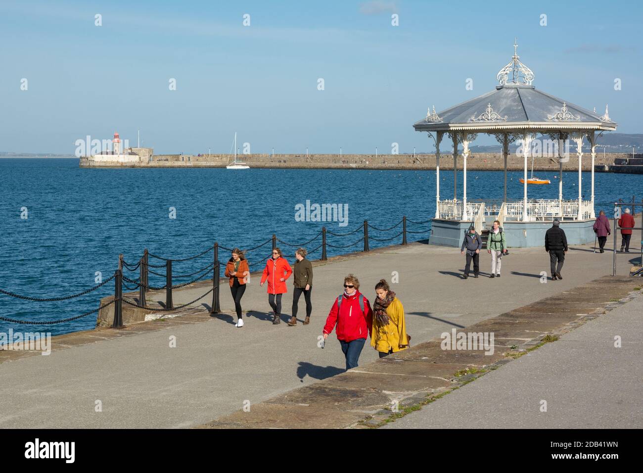 Walking the East Pier on a sunny day at Dun Laoghaire in County Dublin, Ireland Stock Photo