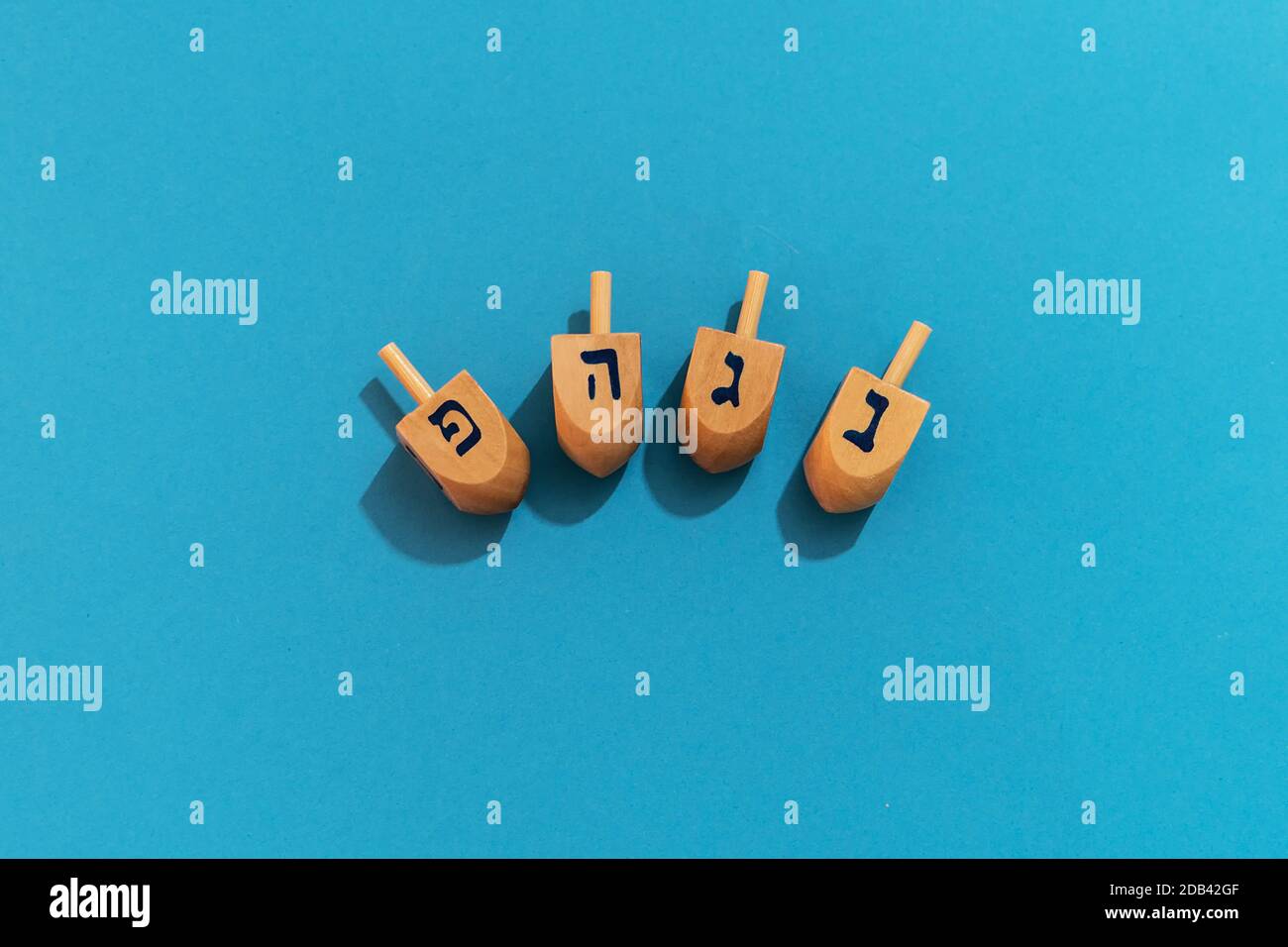 a-top-view-of-hanukkah-dreidel-in-a-blue-background-a-game-played