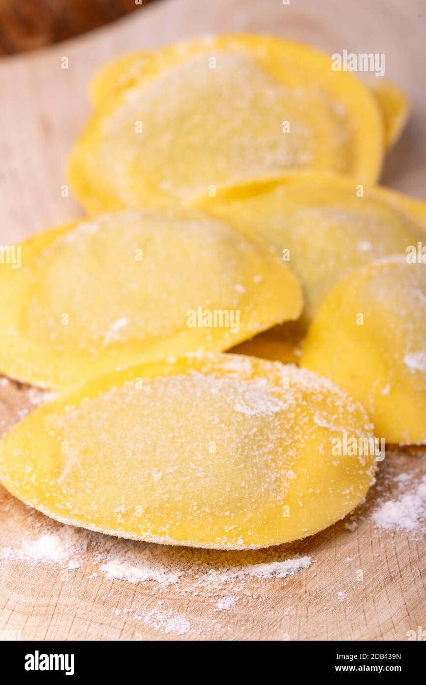 raw italian tortelli pasta with flour Stock Photo