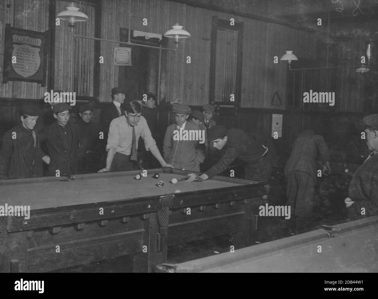 Elm Pool Room (inside): Nathan Sher, 69 Walden St. William Donovan, Elm Pool Room. George, 28 Elm St. (youngest pin boy). Bill Simmons (manager). Frank Worcester, 28 Elm St. Alton Tripp, 31 High St. Theodore Lewis, Elm Pool Room. Donnie Murray, Elm Pool Room. Joe Correia, 36 Elm St. Location: New Bedford, Massachusetts.. Stock Photo