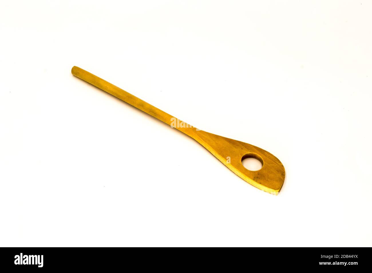 Wooden spoon with a hole on a white background Stock Photo Alamy